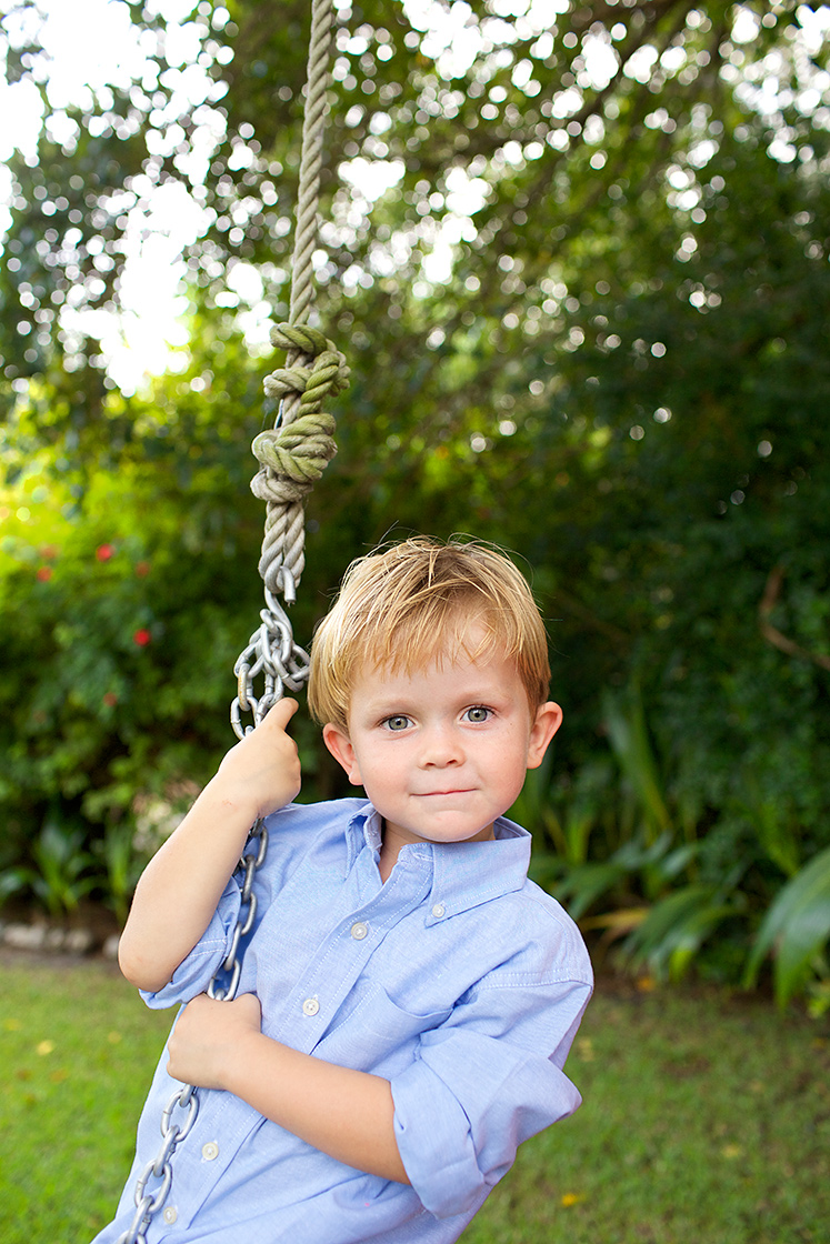 young-boy-portrait-in-front-yard-on-rope-swing-lifestyle-family-and-child-photography-Stuart,-Palm-City,-Hutchinson-Island-Florida-Big-Fish-Studios_Robert-Holland